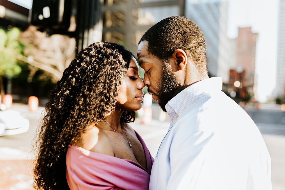 African American couple urban engagement pictures in downtown Louisville Muhammad Ali center and belvedere   #engaged #muhumadalicenter #belvedere #shesaidyes #engaged #padbl #photographyanddesignbylauren #urban #city #urbanengagmentphotos #urbaneng