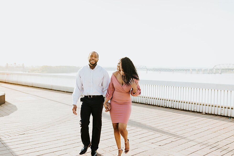  African American couple urban engagement pictures in downtown Louisville Muhammad Ali center and belvedere   #engaged #muhumadalicenter #belvedere #shesaidyes #engaged #padbl #photographyanddesignbylauren #urban #city #urbanengagmentphotos #urbaneng