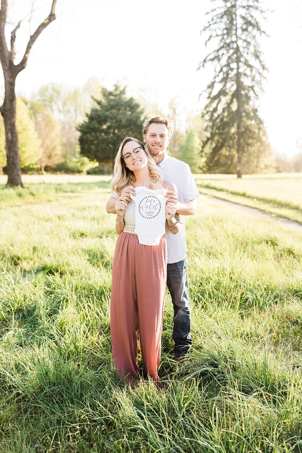  Onesie announcement that a new baby is on the way for this southern couple! announcement for a southern spring session. couple baby on the way expecting excited maternity photography congratulations announcement baby coming soon #padbl #padblmaterni