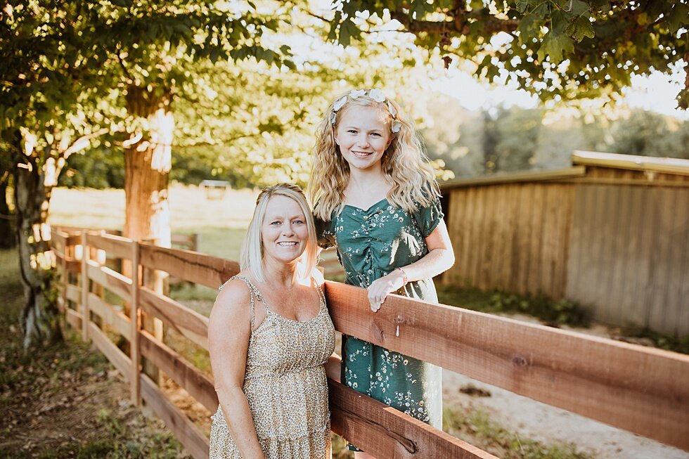  Sweet mother and daughter accentuating the different levels in this photo by using the country farm fence. Fall Louisville Kentucky photographer mother daughter photography session portraits loving relationship western girls country roots #motherdau