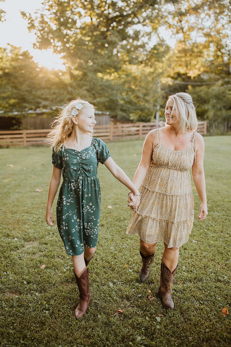  This beautiful mother and daughter walking hand in hand through their Midwest ranch. Fall Louisville Kentucky photographer mother daughter photography session portraits loving relationship western girls country roots #motherdaughter #bondingphotogra