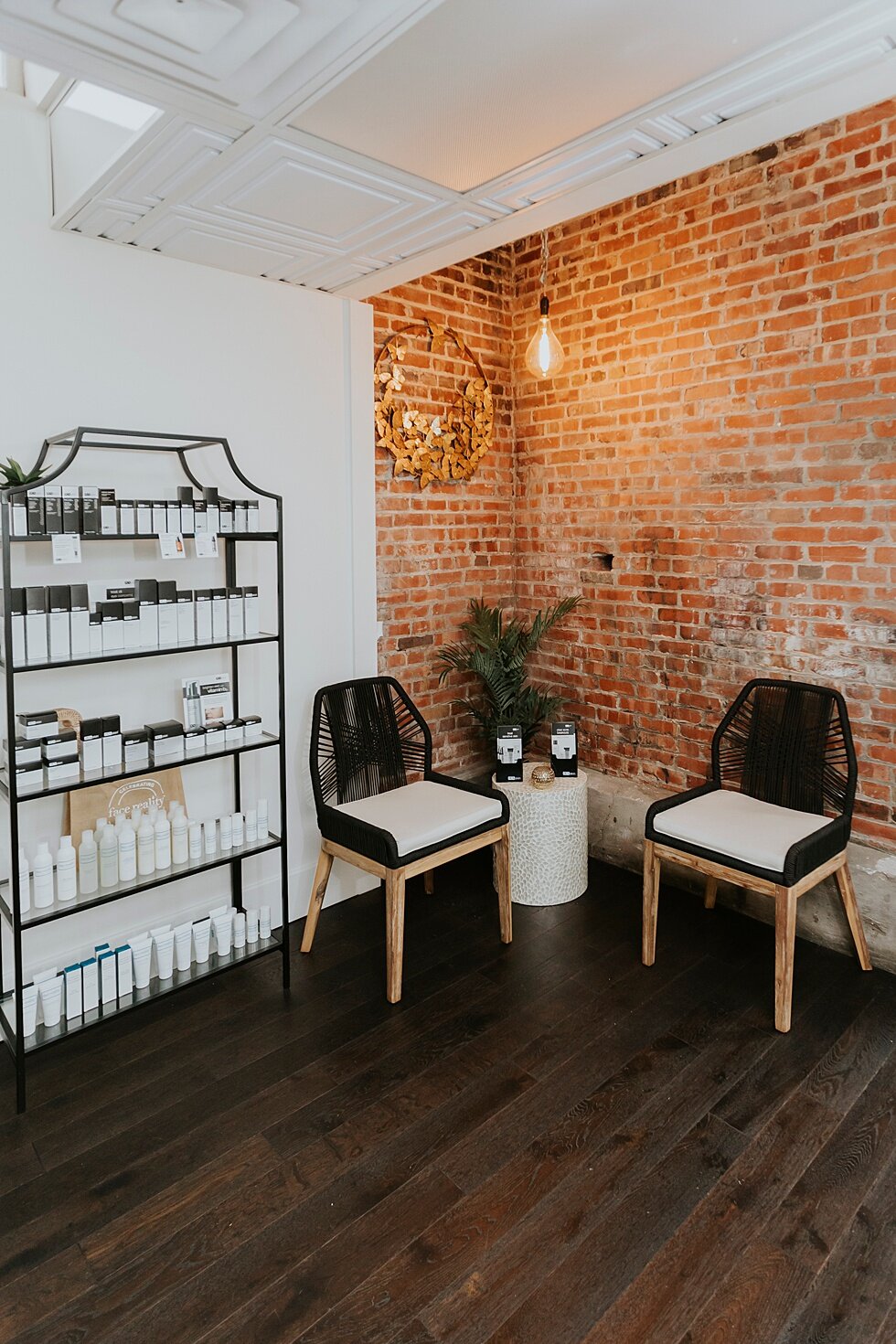  Waiting area for Skincare Boutique branding photography session for Skintuition in Louisville, Kentucky. clean lines modern boutique skincare health branding wellness selfcare gold black spa dermaplaning aesthetician specialty#branding #brandingsess