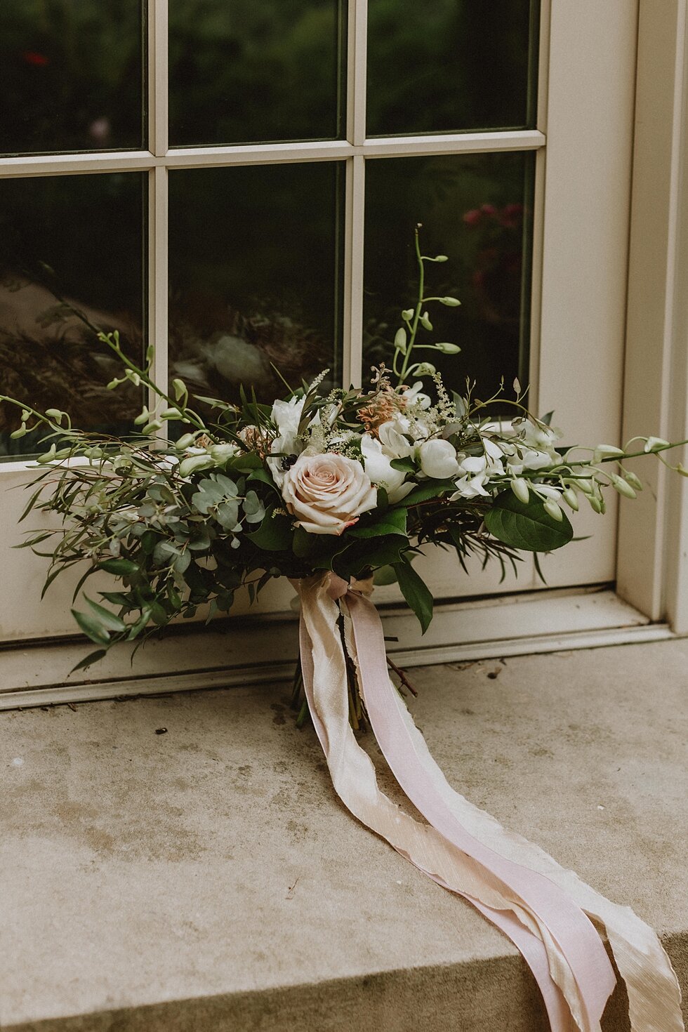  Stunning bridal bouquet for an intimate elopement ceremony in the south complete with feathers in the bouquet. elopement goshen crest farm louisville kentucky elopement photographer simplistic sweet intimate stunning backyard farm wedding #springwed