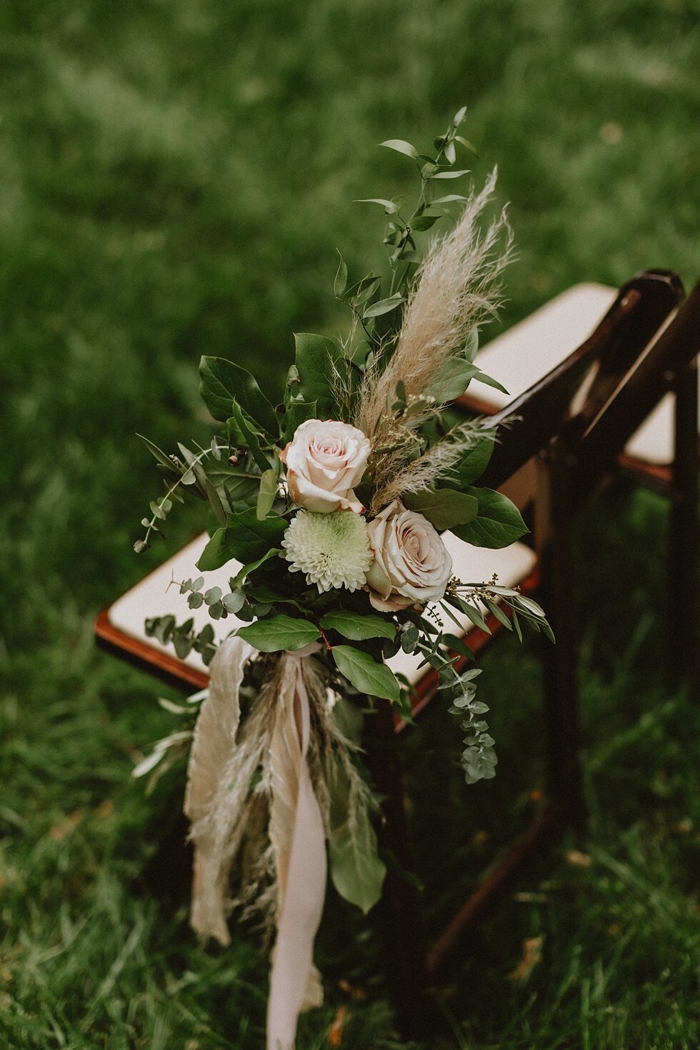  Each chair had such special touches as the floral arrangements were tied to the chairbacks and were stunning. elopement goshen crest farm louisville kentucky elopement photographer simplistic sweet intimate stunning backyard farm wedding #springwedd