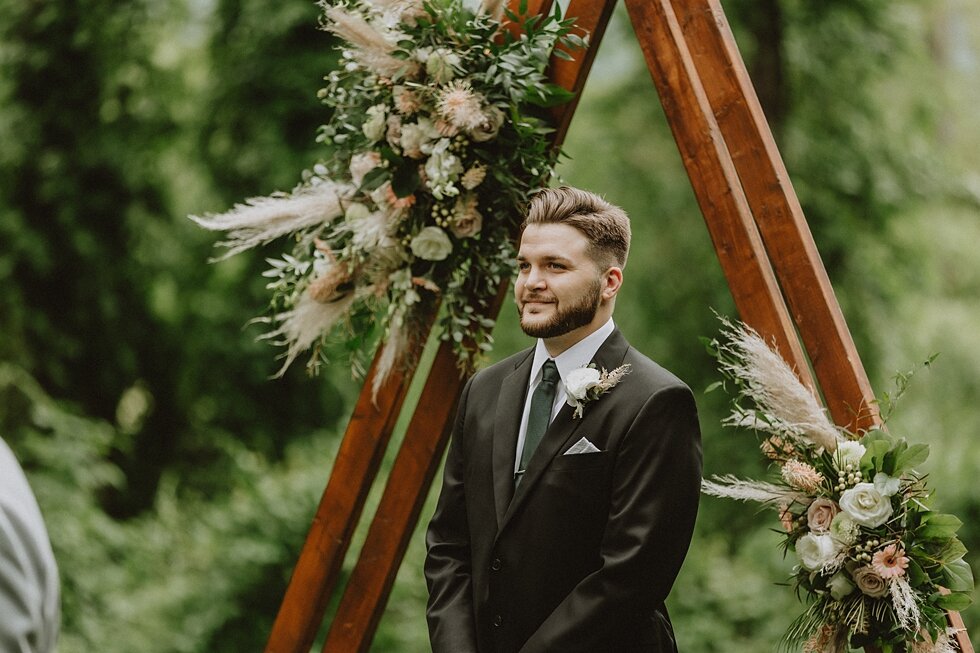 The groom watching his lovely bride walk down the aisle at their intimate farm wedding. elopement goshen crest farm louisville kentucky elopement photographer simplistic sweet intimate stunning backyard farm wedding #springweddingday #elopement #wed