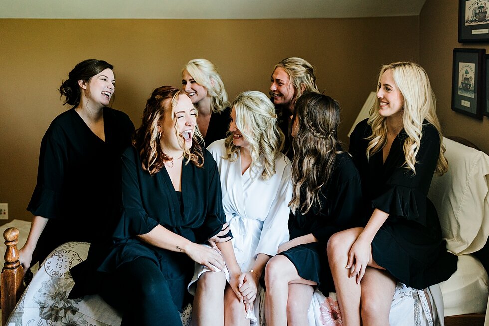  Supporting the bride, this bridal party was a huge party of this wedding day going without a hitch. Romantic casual lace wedding gown close friends neutral colors background wedding natural greenery crisp white #midwestphotographer #kywedding #louis
