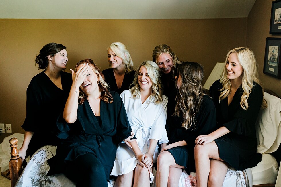  The best group of ladies there to support this stunning bride on her wedding day in Louisville, Kentucky! Romantic casual lace wedding gown close friends neutral colors background wedding natural greenery crisp white #midwestphotographer #kywedding 