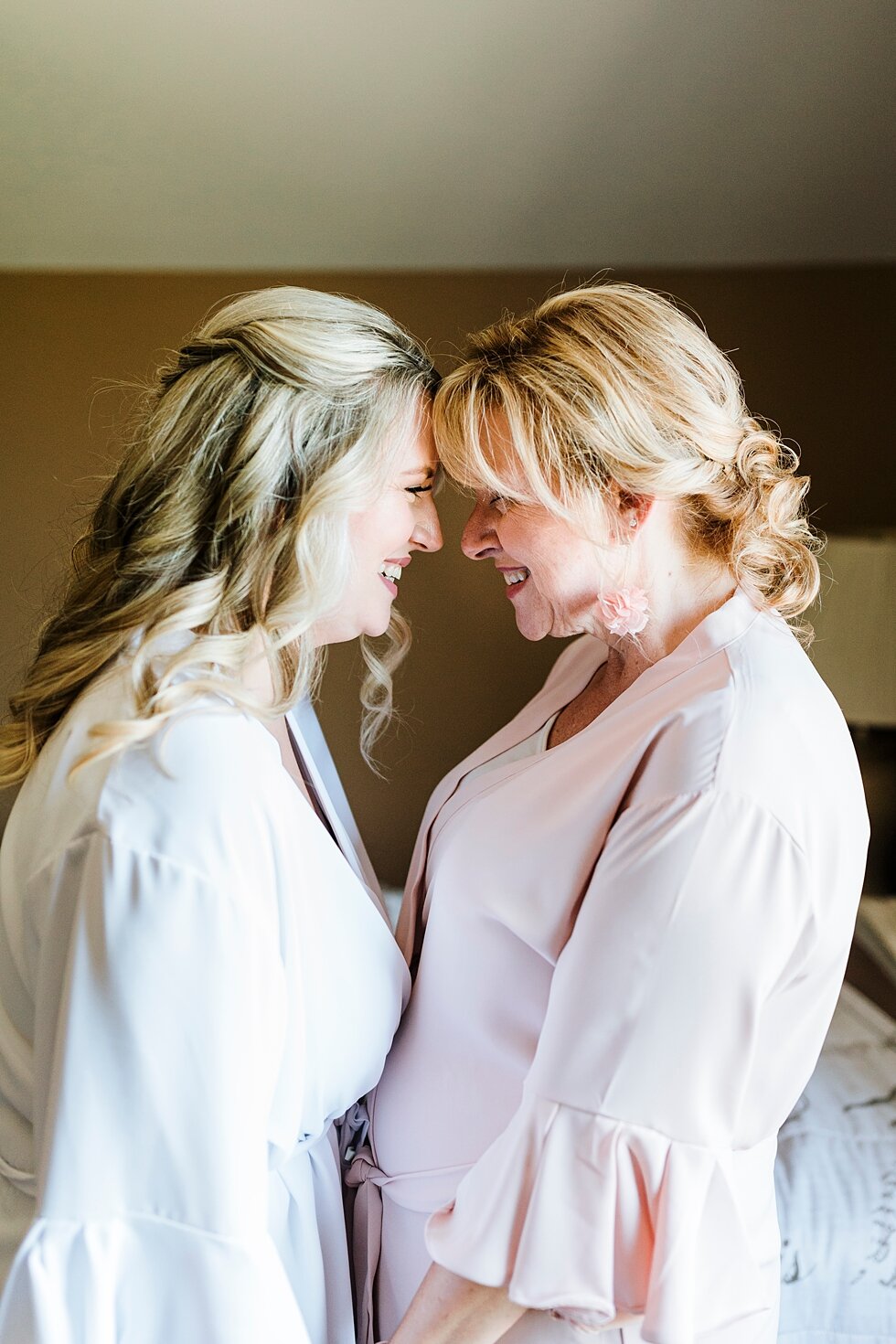  Beautiful mother and daughter getting ready for such a special wedding in Louisville, Kentucky! Romantic casual lace wedding gown close friends neutral colors background wedding natural greenery crisp white #midwestphotographer #kywedding #louisvill