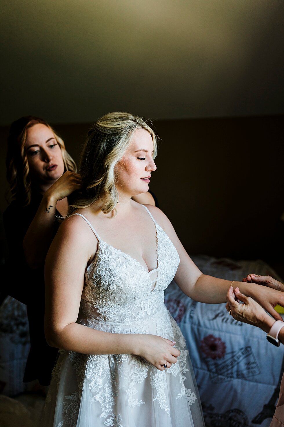  These last minute touches put the absolute cherry on the top of a beautiful ensemble for this bride! Romantic casual lace wedding gown close friends neutral colors background wedding natural greenery crisp white #midwestphotographer #kywedding #loui