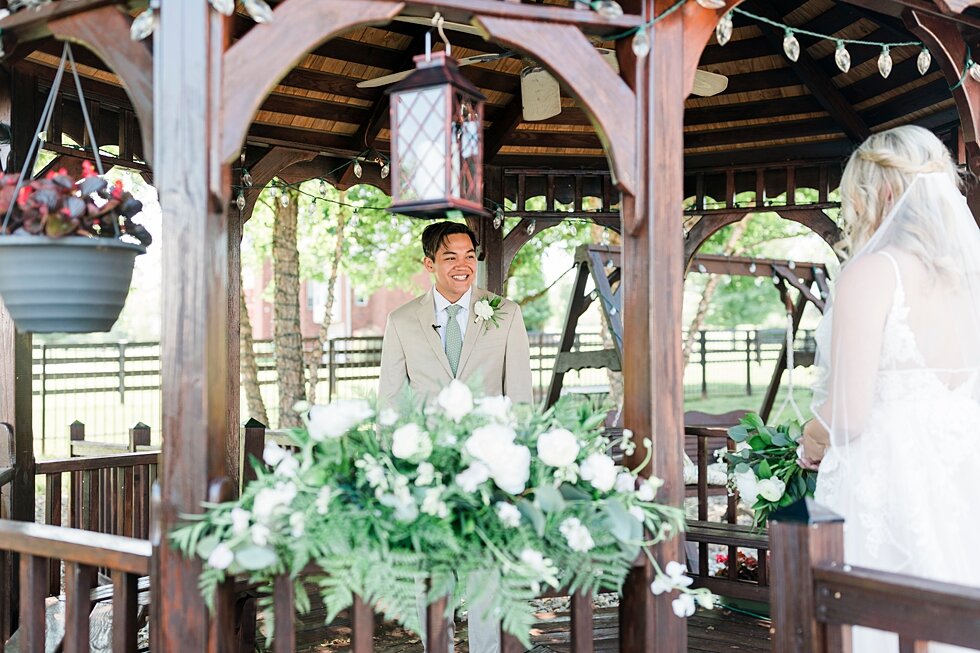  Meeting in this wooden lovely gazebo, this couple prepares to tie the knot. Romantic casual lace wedding gown close friends neutral colors background wedding natural greenery crisp white #midwestphotographer #kywedding #louisville #kentuckywedding #