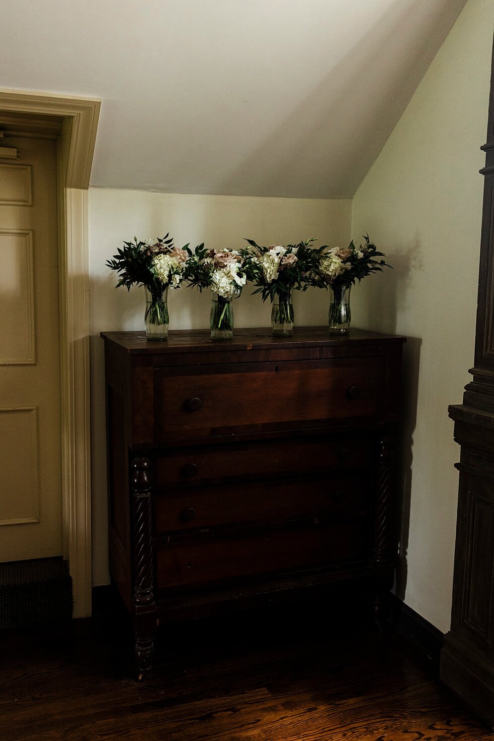  Bridal party bouquets set on top of a rustic dresser ready and waiting for everyone to be ready for the bride to walk down the aisle. Kentucky wedding photographer wedding bliss just married love ceremony inspiration garden wedding intimate #farming