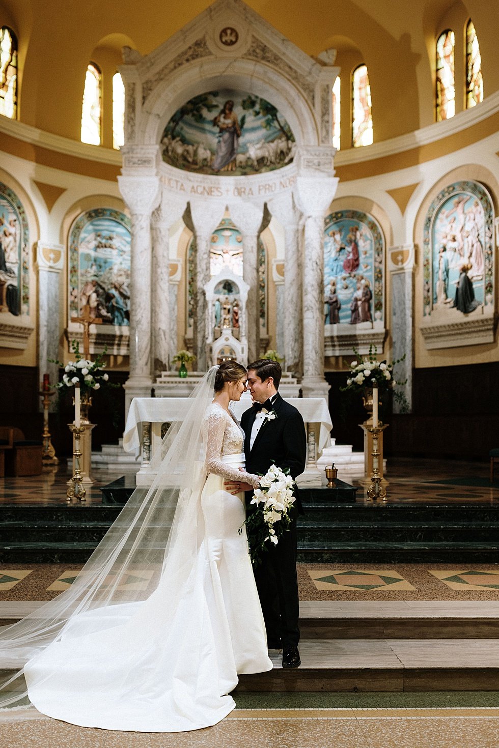  Bride and groom portrait at St Agnes Catholic Curuch. Lauren and Adam's winter wedding at St Agnes Catholic church and the Frazier History Museum. 