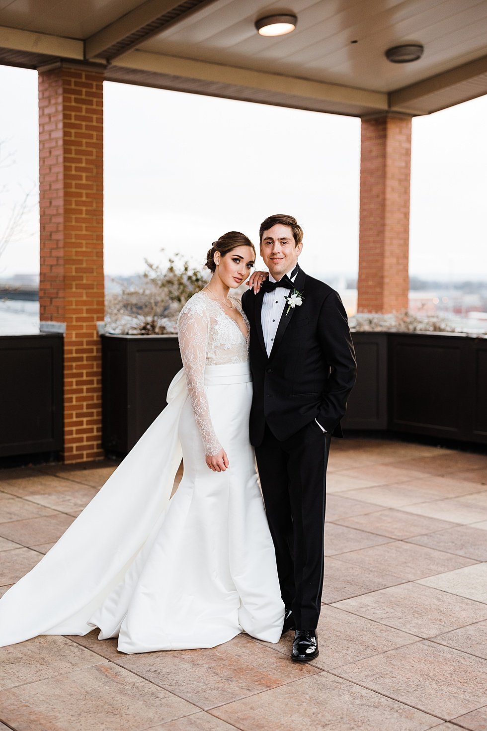  Bride and Groom wedding day portraits at Frazier History museum rooftop and garden. Lauren and Adam's winter wedding at St Agnes Catholic church and the Frazier History Museum. 