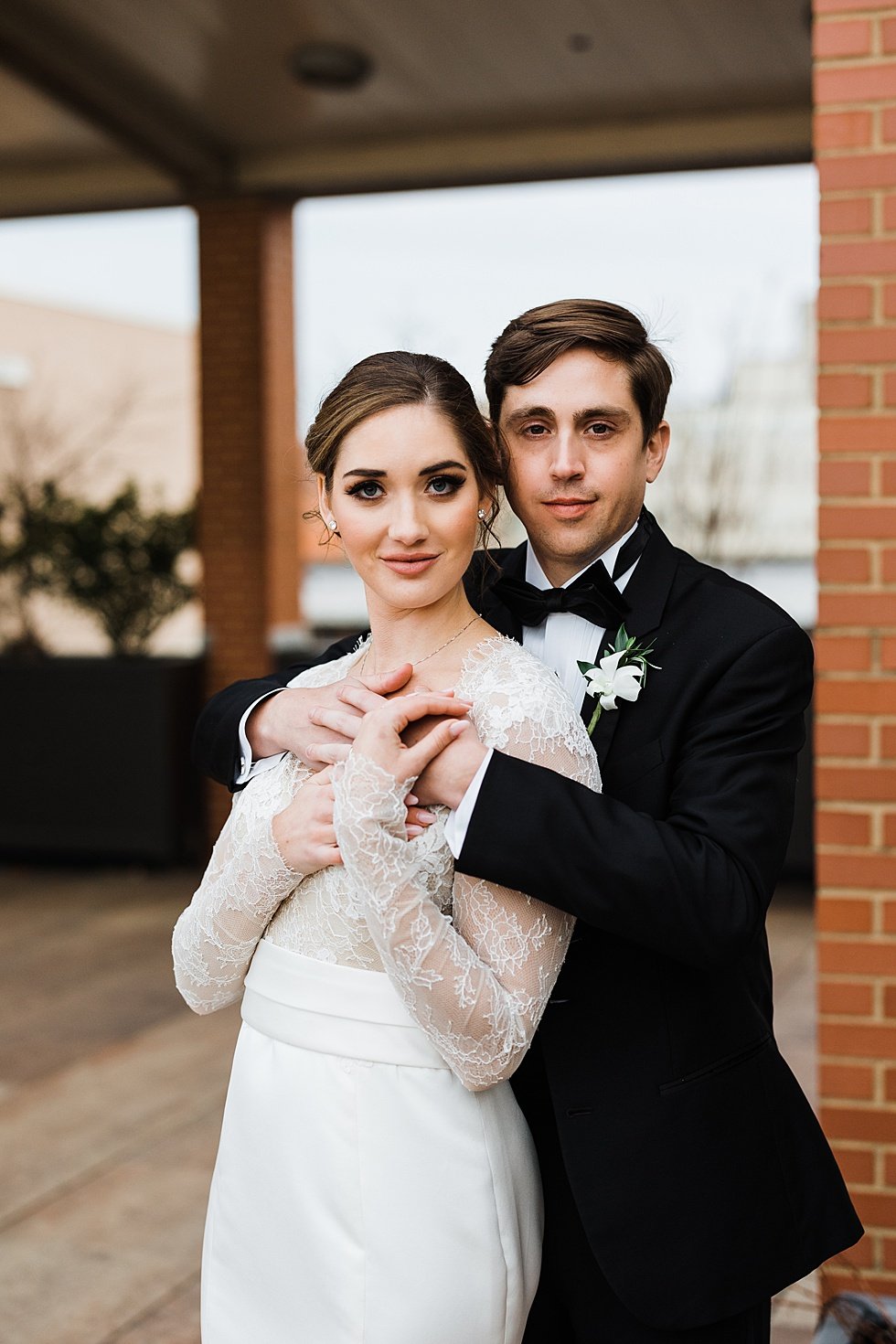  Bride and Groom wedding day portraits at Frazier History museum rooftop and garden. Lauren and Adam's winter wedding at St Agnes Catholic church and the Frazier History Museum. 