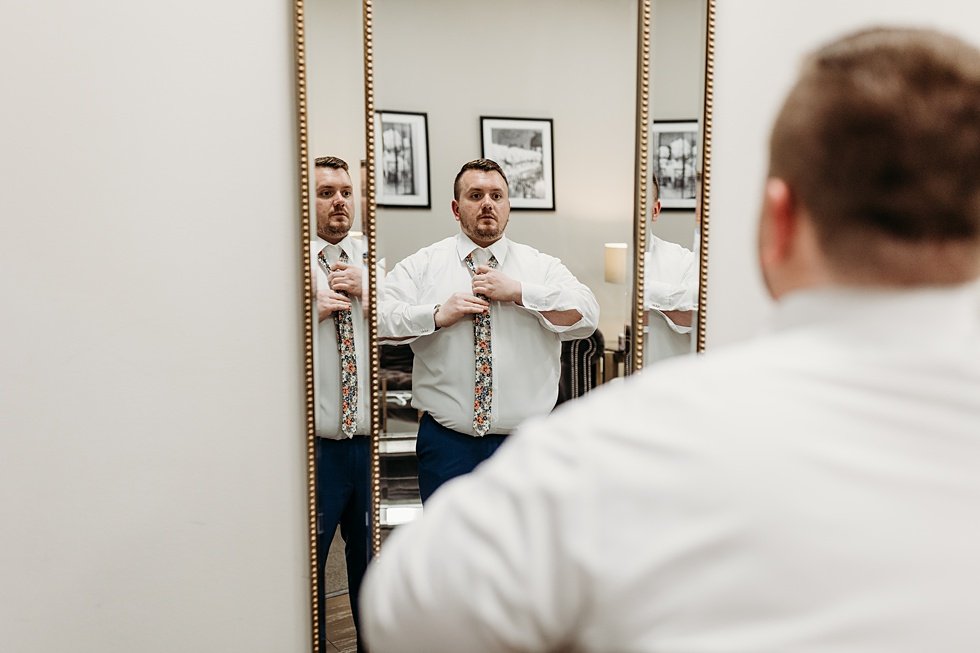  Groom getting ready on wedding day. Spring wedding at The Refinery Jeffersonville, Indiana 