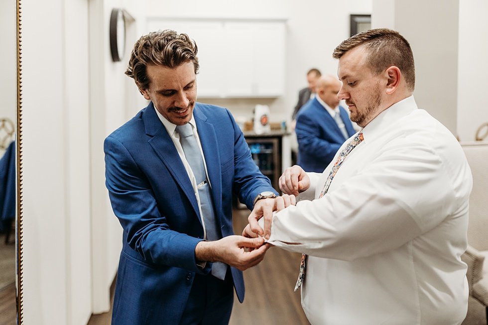  Groom getting ready on wedding day. Spring wedding at The Refinery Jeffersonville, Indiana 
