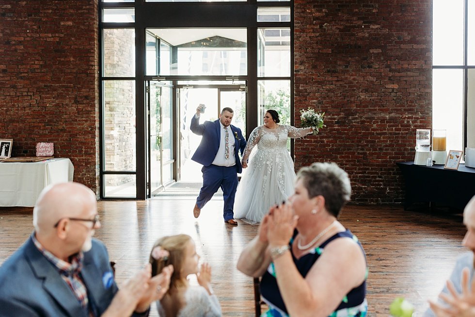  Bride and Groom entrence to reception. Spring wedding at The Refinery Jeffersonville, Indiana 
