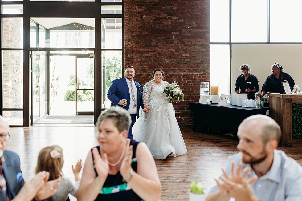  Bride and Groom entrence to reception. Spring wedding at The Refinery Jeffersonville, Indiana 
