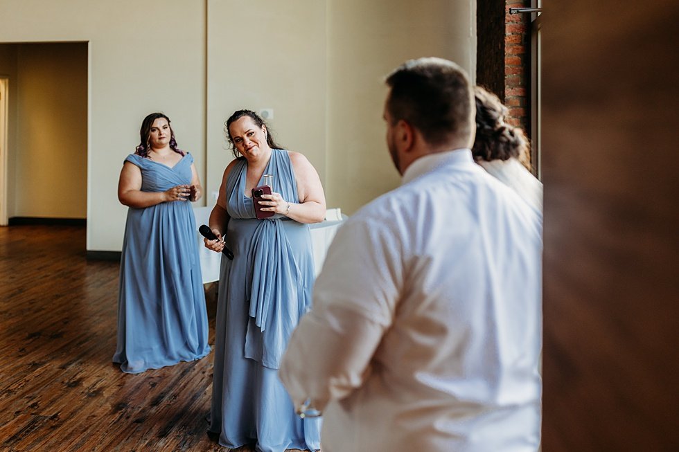  Wedding toasts to bride and groom. Spring wedding at The Refinery Jeffersonville, Indiana 