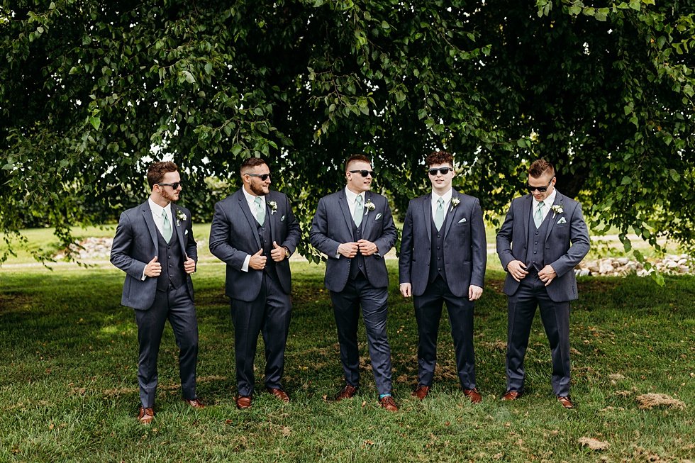  Groom and groomsmen portraits. Wedding at Huber's Orchard and Winery in Starlight, Indiana. 