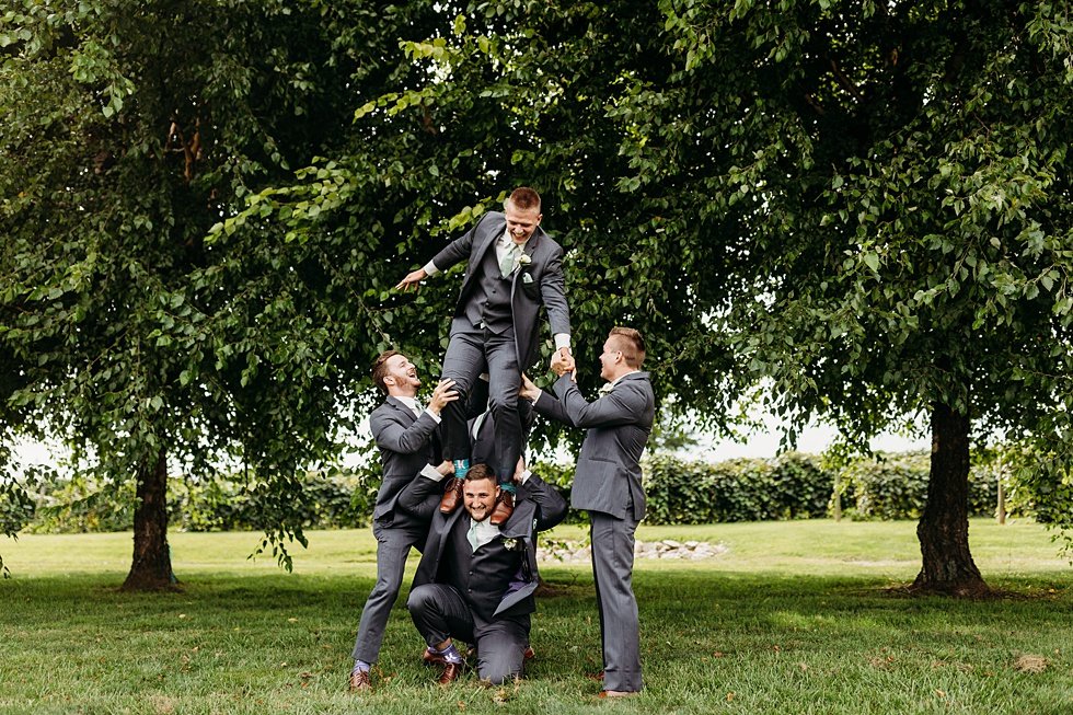  Groom and groomsmen portraits. Wedding at Huber's Orchard and Winery in Starlight, Indiana. 
