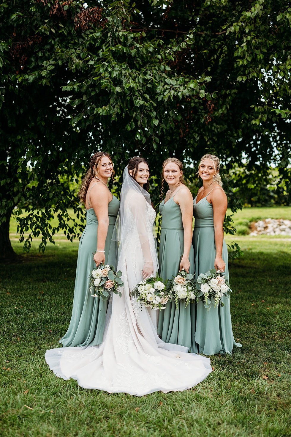  Bride and bridesmaids portraits. Wedding at Huber's Orchard and Winery in Starlight, Indiana. 