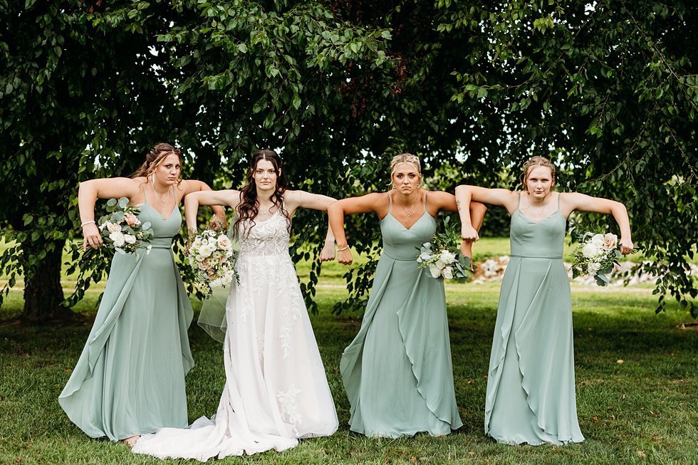  Bride and bridesmaids portraits. Wedding at Huber's Orchard and Winery in Starlight, Indiana. 