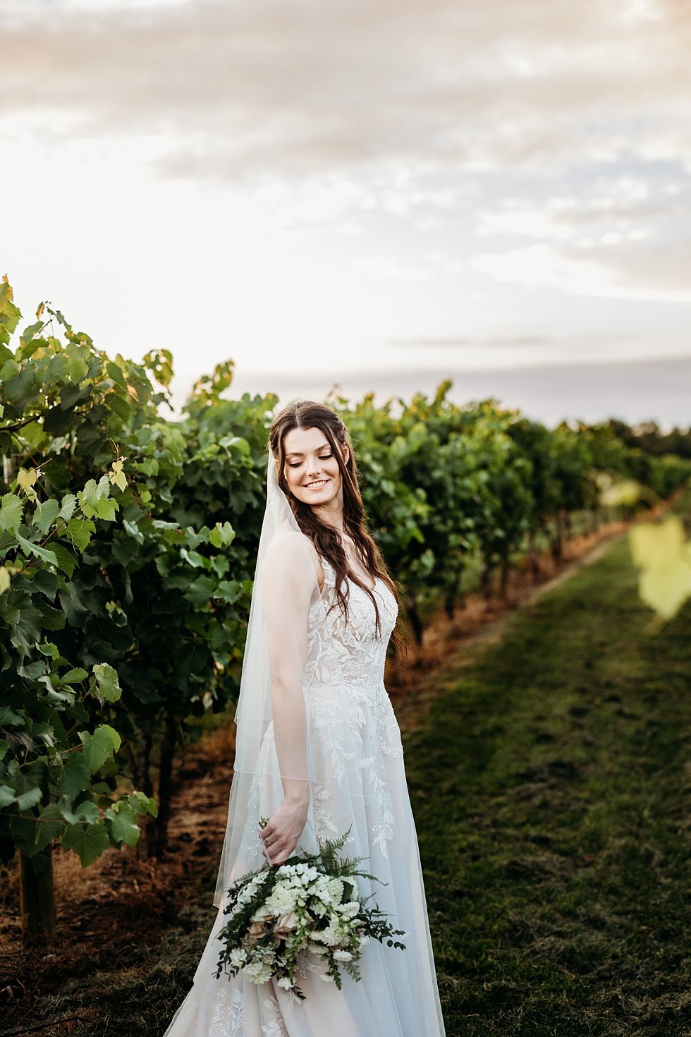  Sunset bridal portraits in vineyard. Wedding at Huber's Orchard and Winery in Starlight, Indiana. 