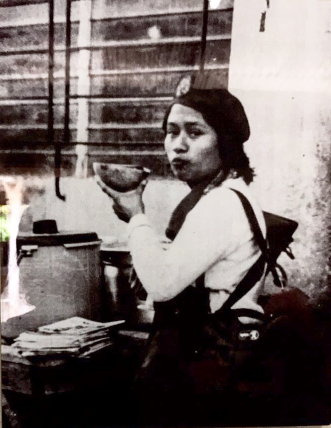  Guerrillera drinking from a huacal (bowl). 