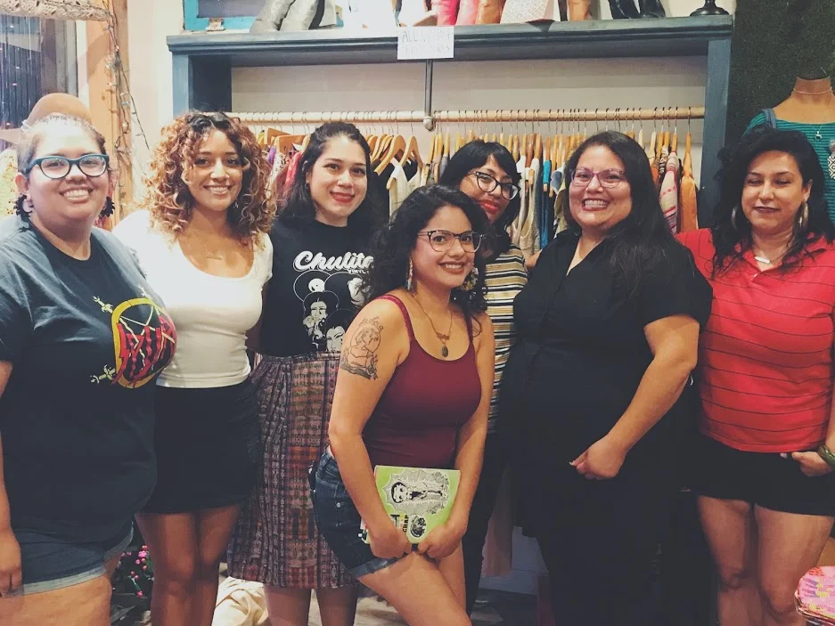 From Left: Isabel Ann Castro of St. Sucia, Eugenia Nicole, Yeiry Guevara, Alma Rosa Rivera, Xitlalic Guijosa, Rebecca Gonzales. First Row: Natasha Hernandez of St. Sucia