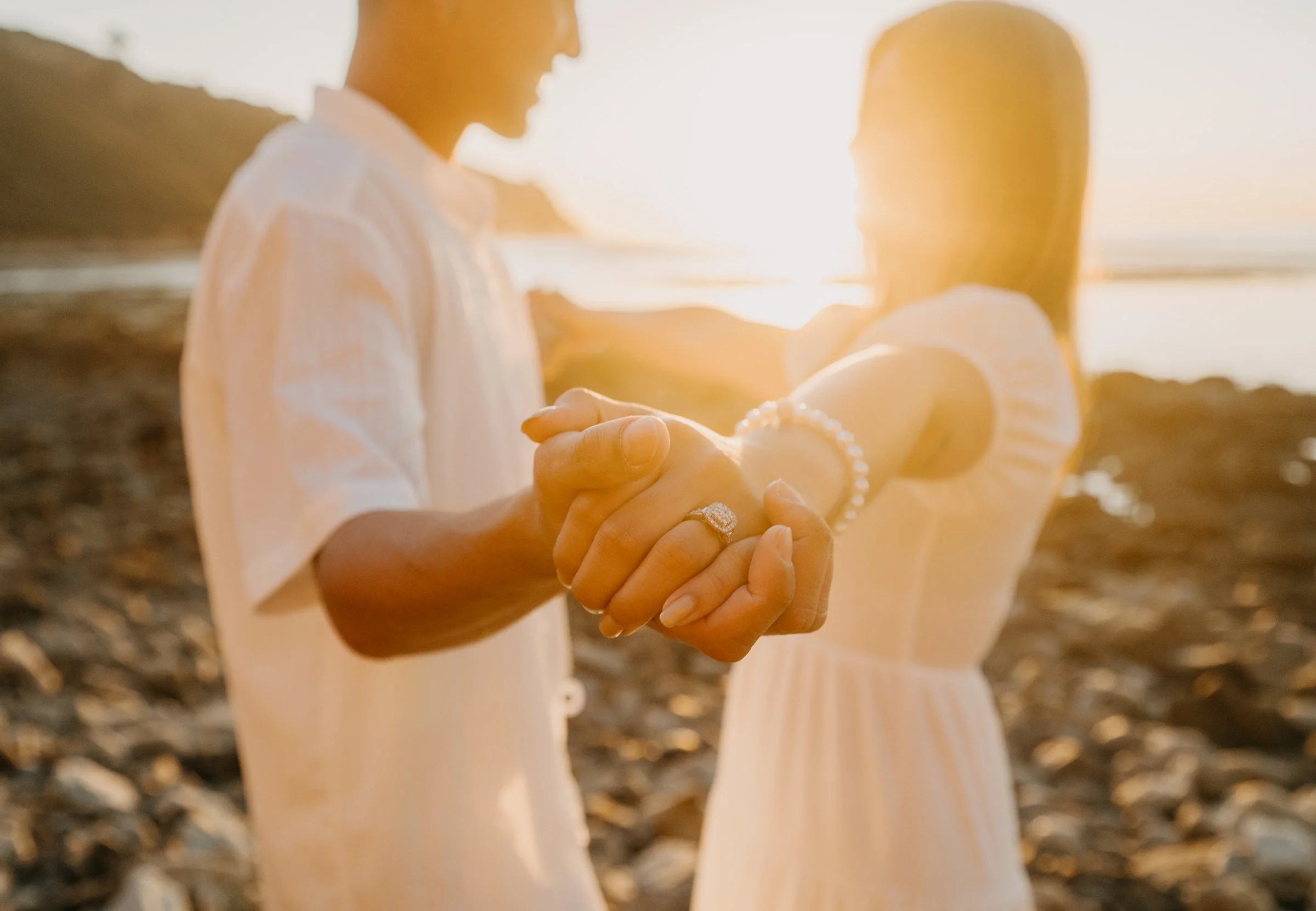 Close-up of an engagement ring during a sunset engagement session at Bluff Cove in Palos Verdes Estates, California