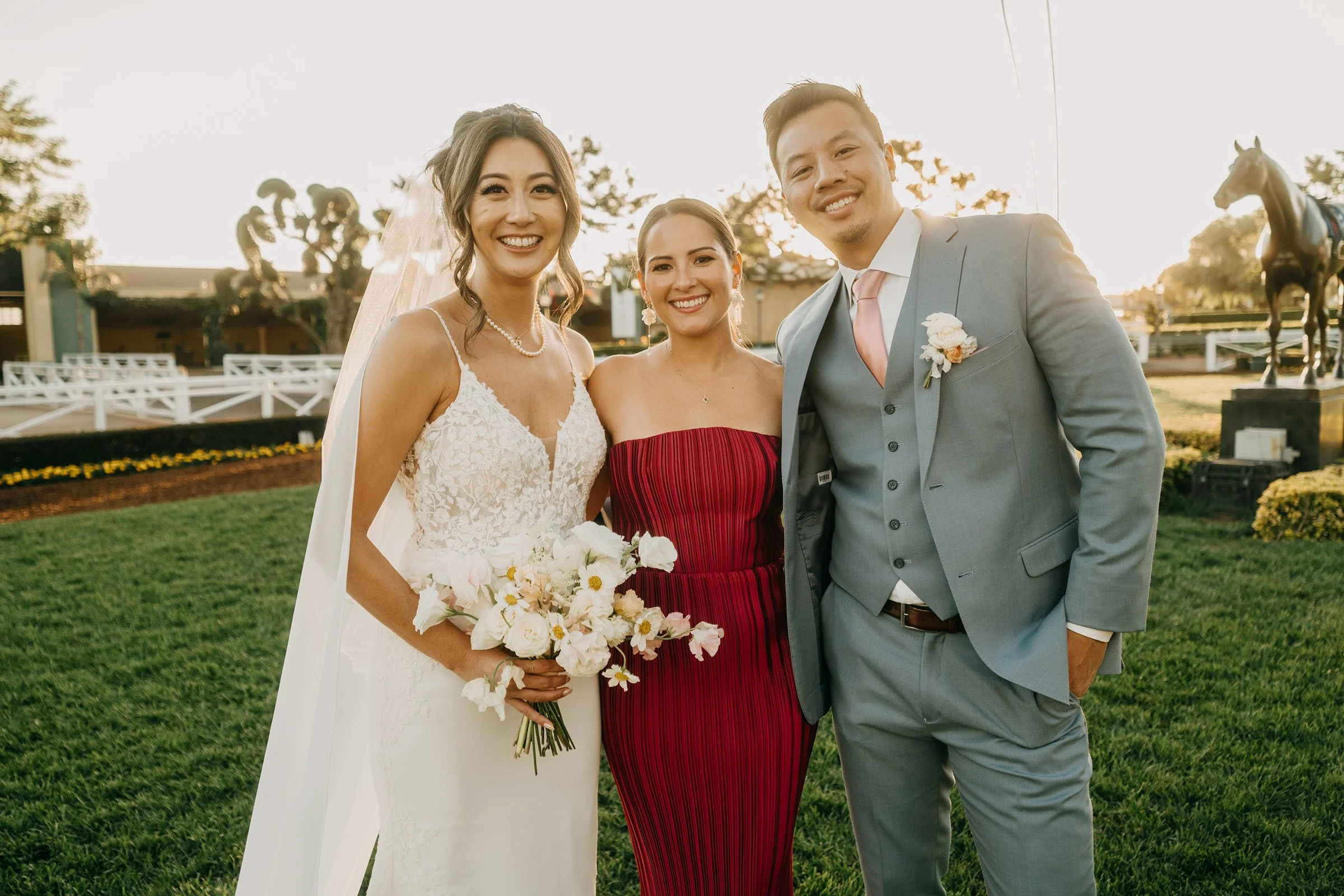 Bride and groom wedding portraits with friends at Santa Anita Park in Arcadia California