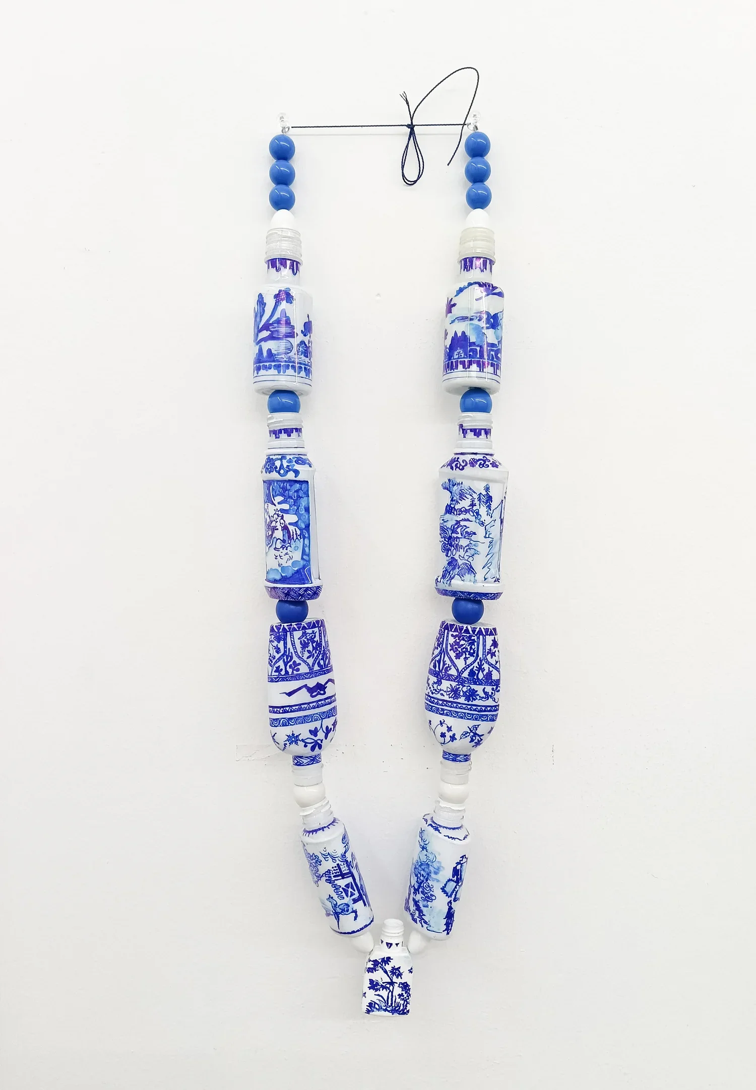 Sarah Goffman, Curator’s Necklace 2025, PET plastic, enamel paint, permanent marker, string, 550 mm x 150 mm