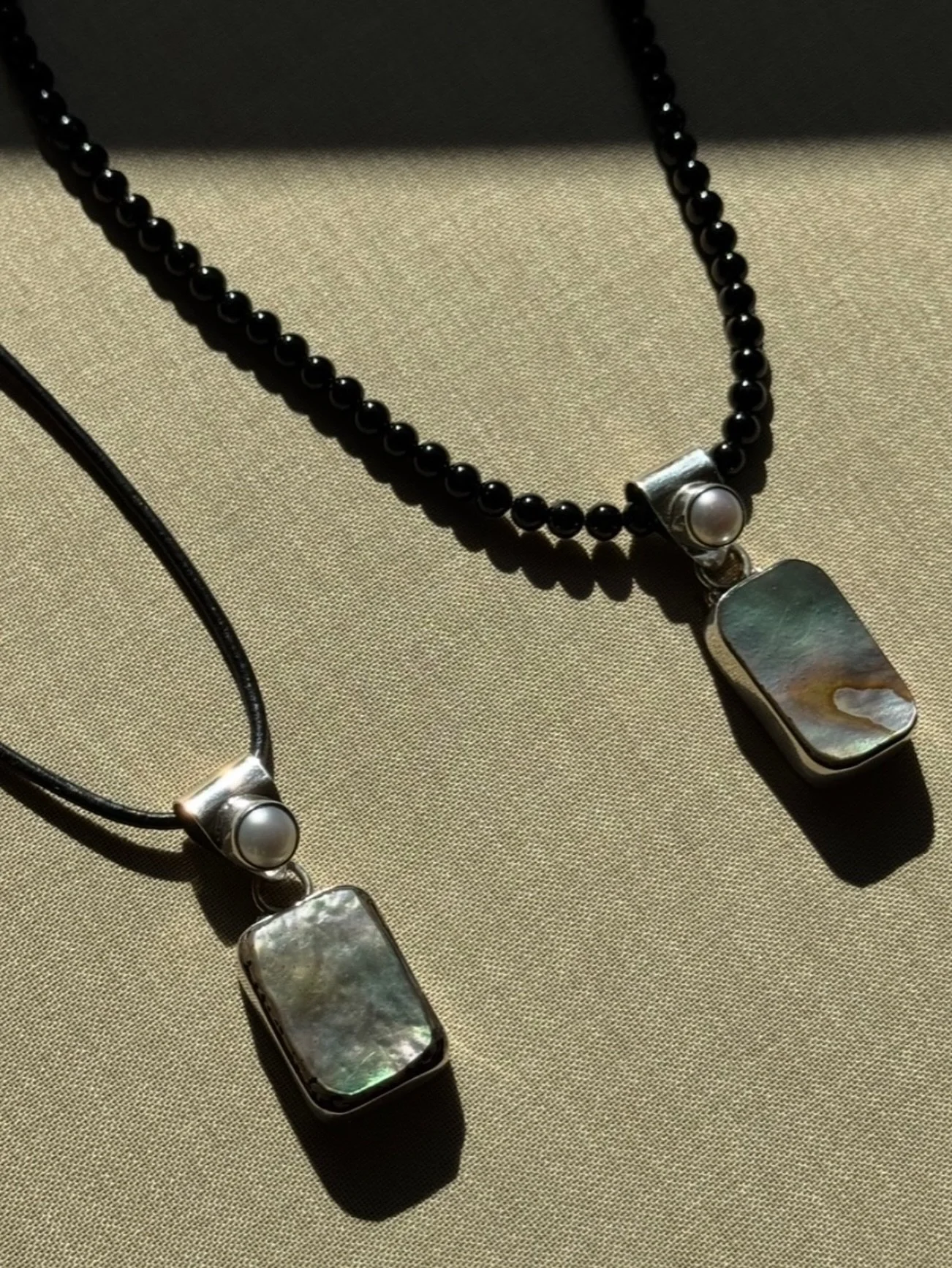 The S+P abalone pendant necklace. Available on black leather cord or onyx beads 〰️ online now