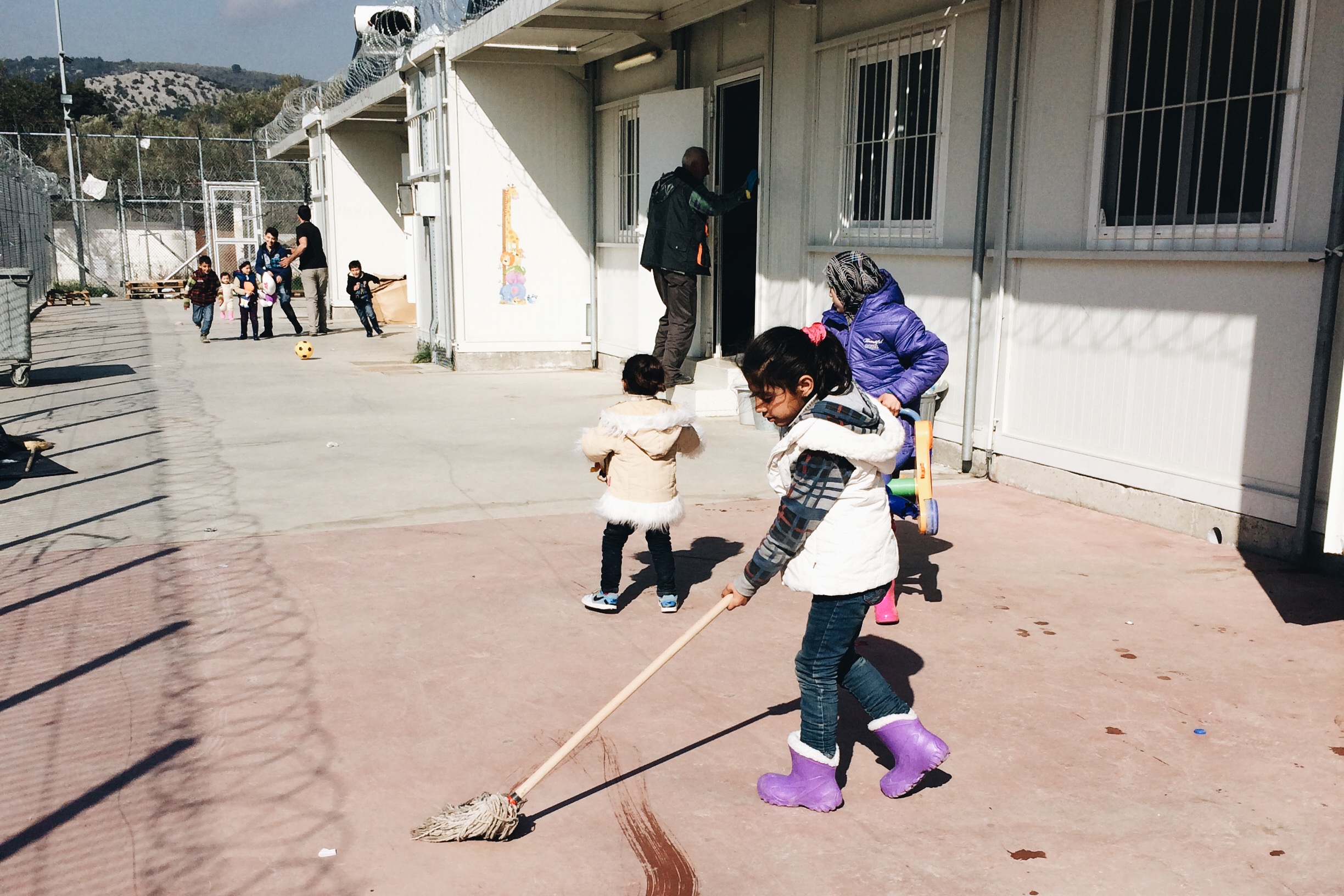 Playing games and helping volunteers clean in the mornings.
