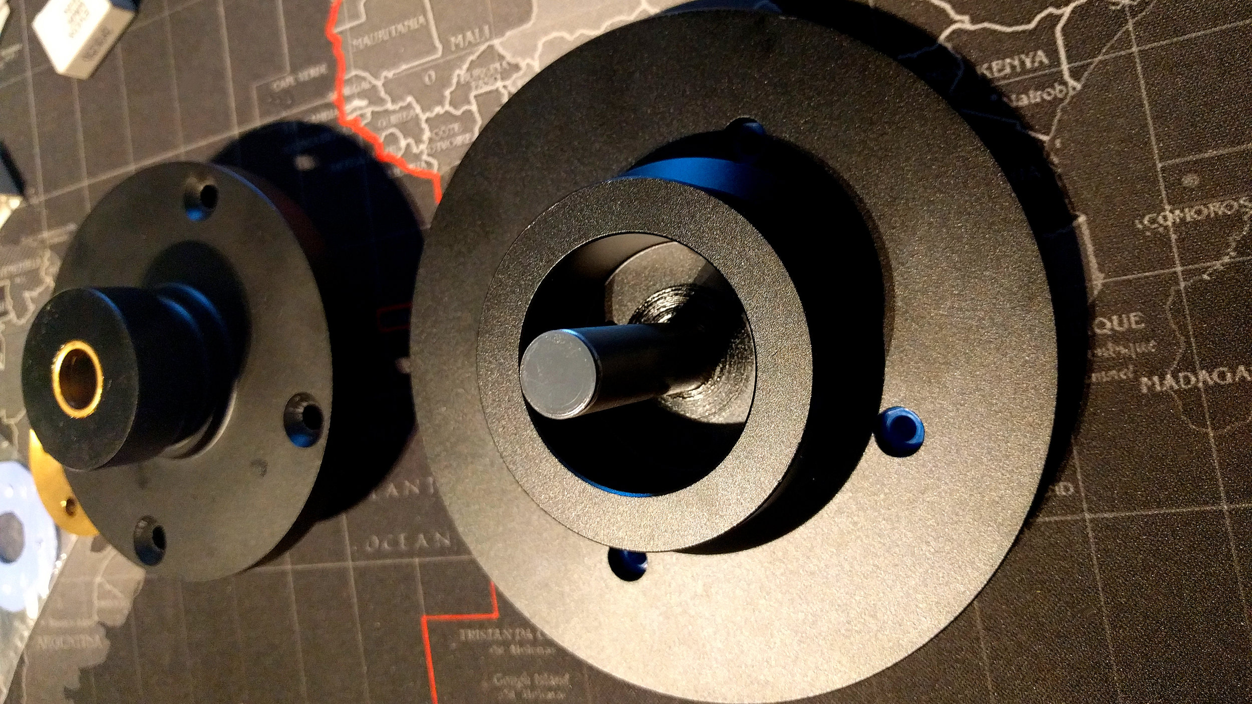 The upper sleeve and spindle/sub platter. Combined with the thrust plate and lower sleeve above, it now accommodates a huge oil reservoir.