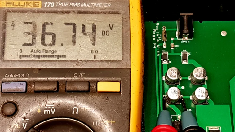 The Ol' Yeller Fluke says 36.74VDC and it's never wrong. After 14 years of being dropped, burned, drowned, crushed, retired, resurrected and retired again it's still going strong. It's outlived numerous other meters and I still use it all day, every day. In fact, it's my 4th most used tool, after the soldering iron, side cutters and sarcasm.