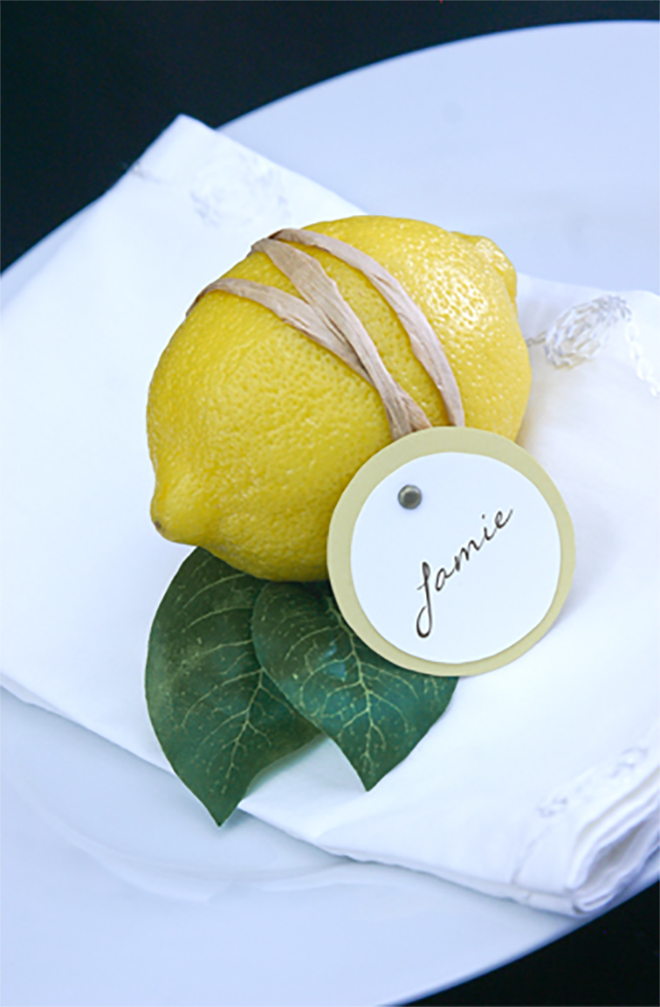 Photo: Something Turquoise Place settings are not a requirement - but they can be so much fun to make and get creative with! I love this simple place setting using a fresh lemon, rubber band and a small tag. Simple, colorful, and it can be used to flavor your tea (or cocktail) later! You could also write on a small tile (such as subway tiles from the hardware store) or a simple white card is always classic. 