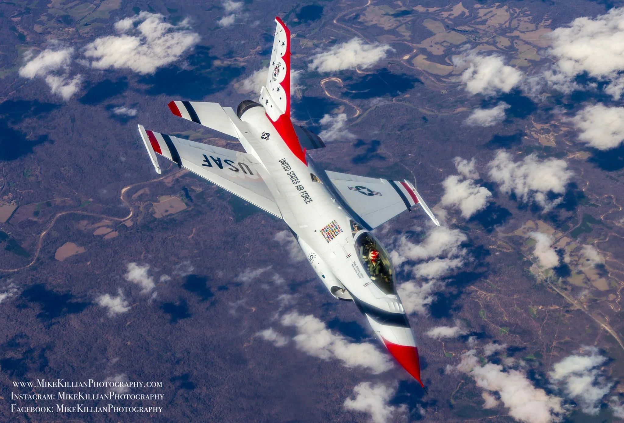 A red, white, and blue F-16 Fighting Falcon rolls out of a pitch following an aerial refueling from a KC-135 tanker. Photo courtesy of Mike Killian.