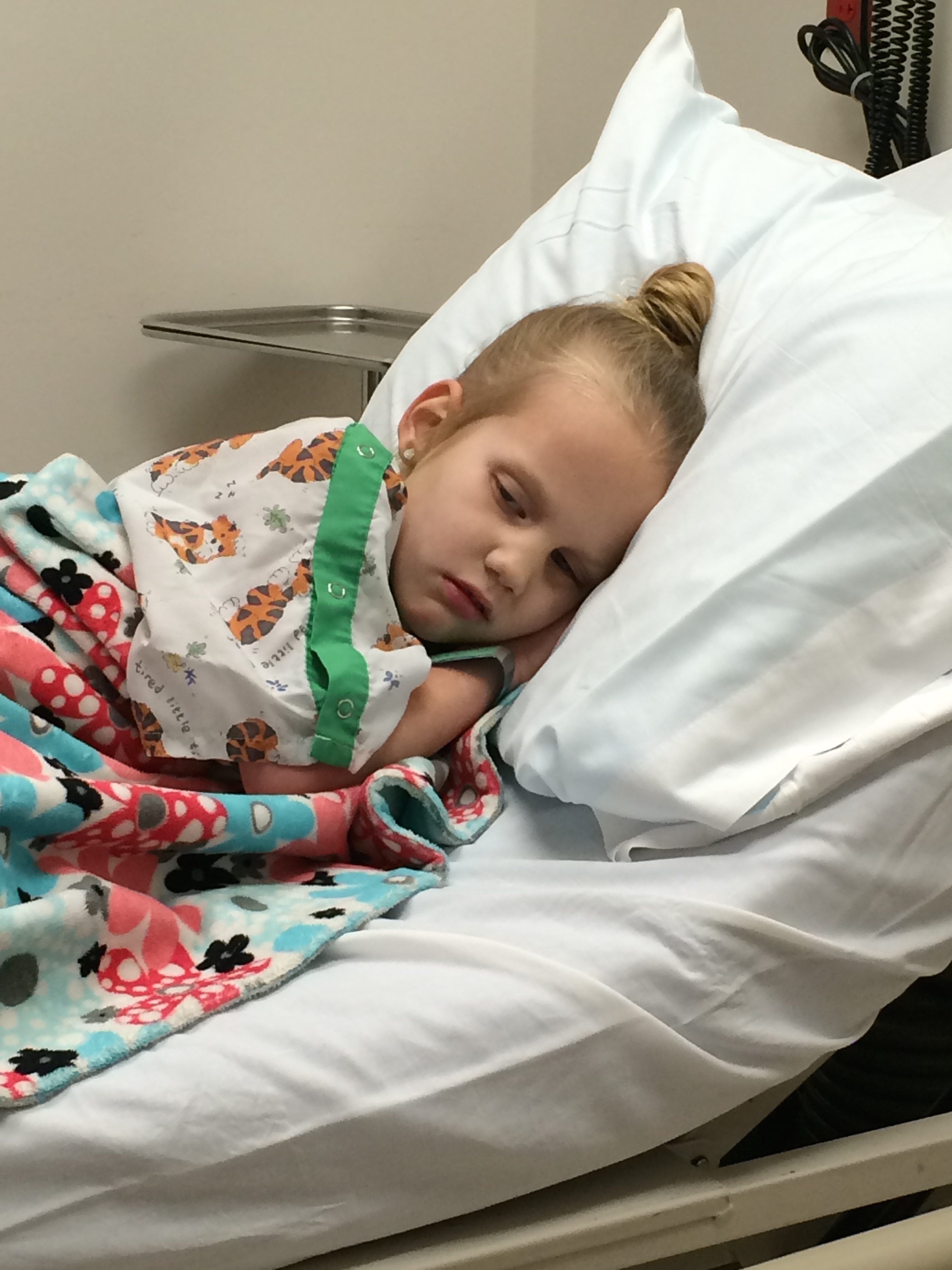 Kycie sleeping while waiting for LifeFlight to arrive.