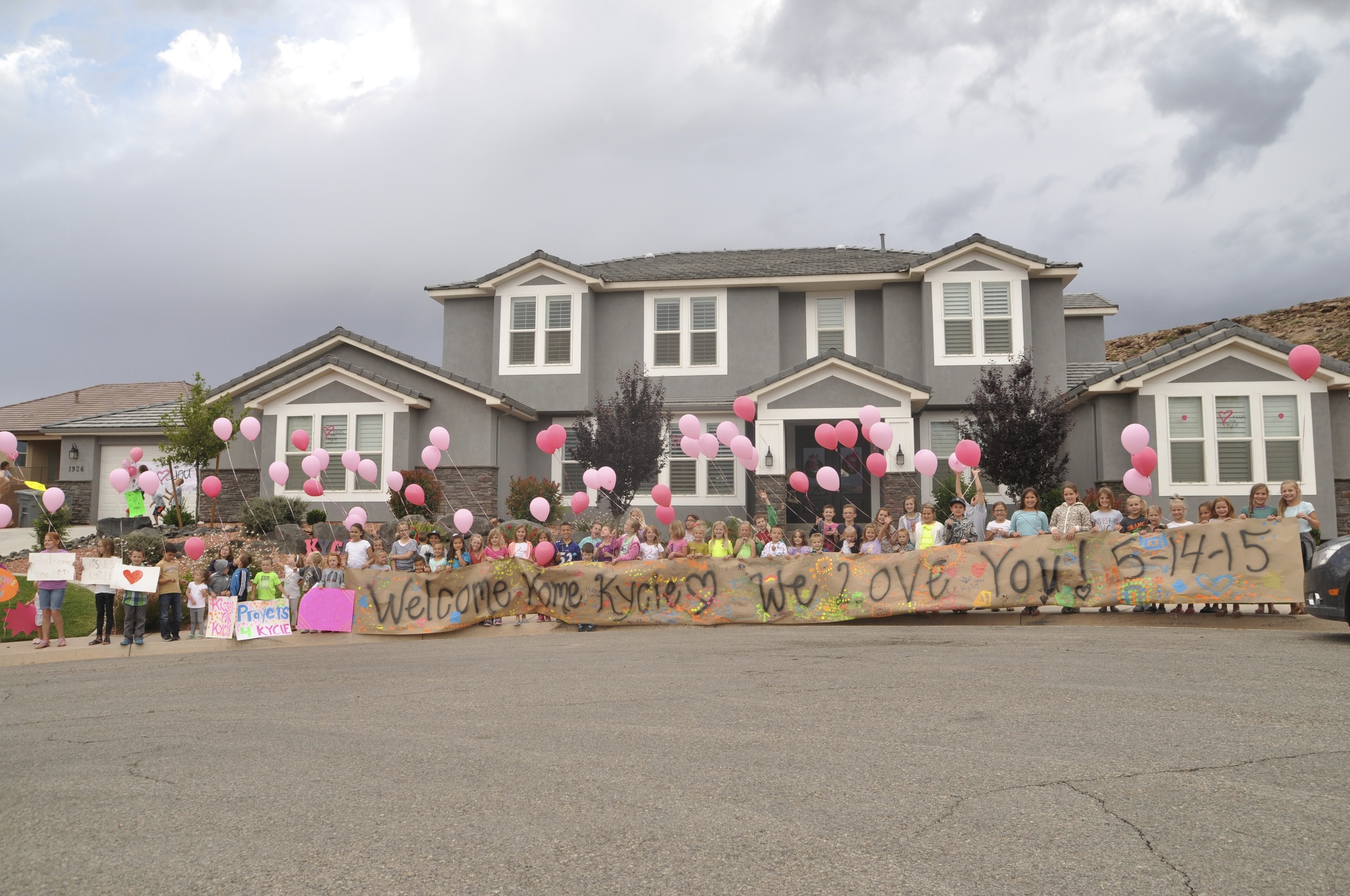 Kycie's friends gather for a picture before she arrives.