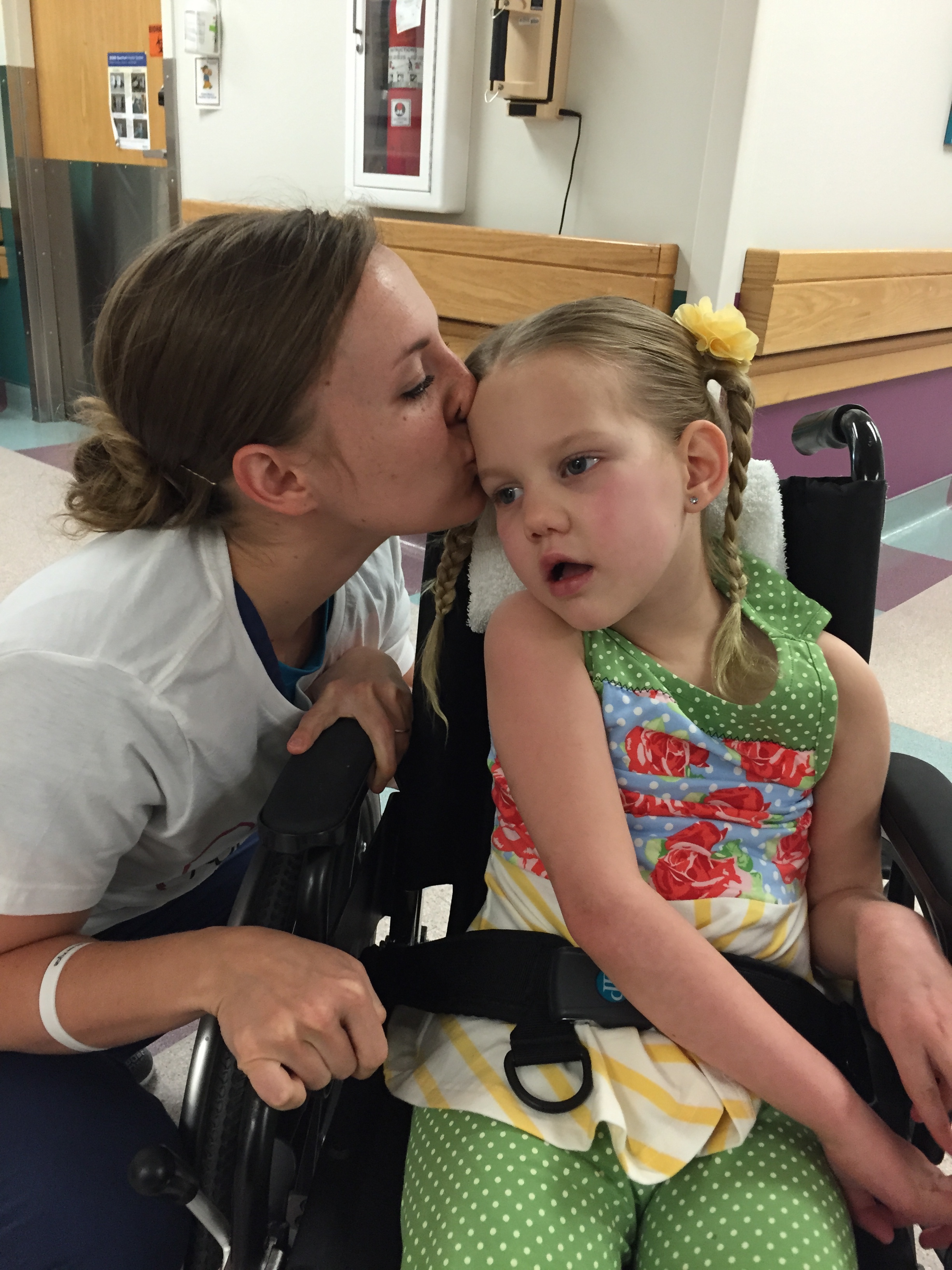 She can get in trouble for kissing her patient, but this little Courtney was life saver. I love this picture of her kissing Kycie goodbye. 