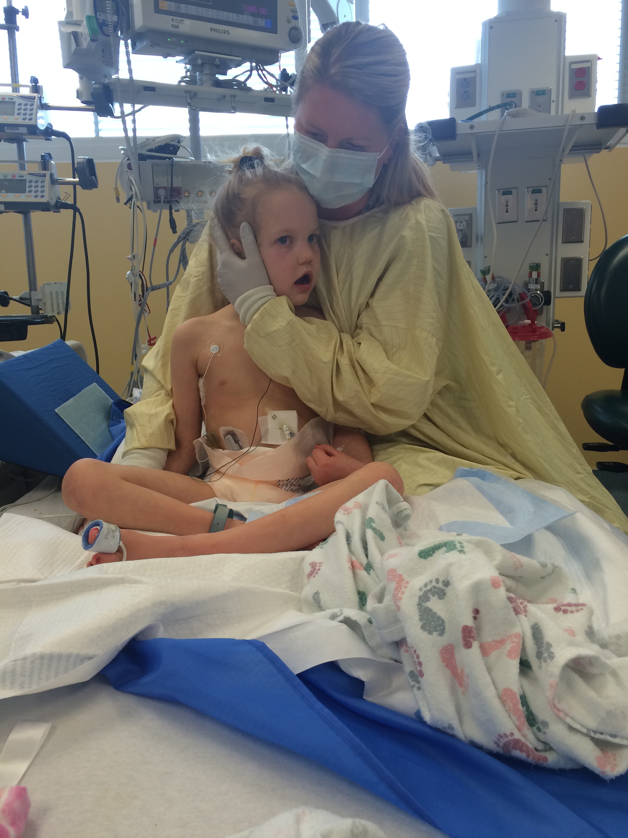 One of my favorite pictures. Kycie's OP (Occupational Therapist) who worked so hard with Kycie during her previous 111 days at PCMC. Jamie caught her giving Kycie a hug. She whole heartedly loved little Sis.