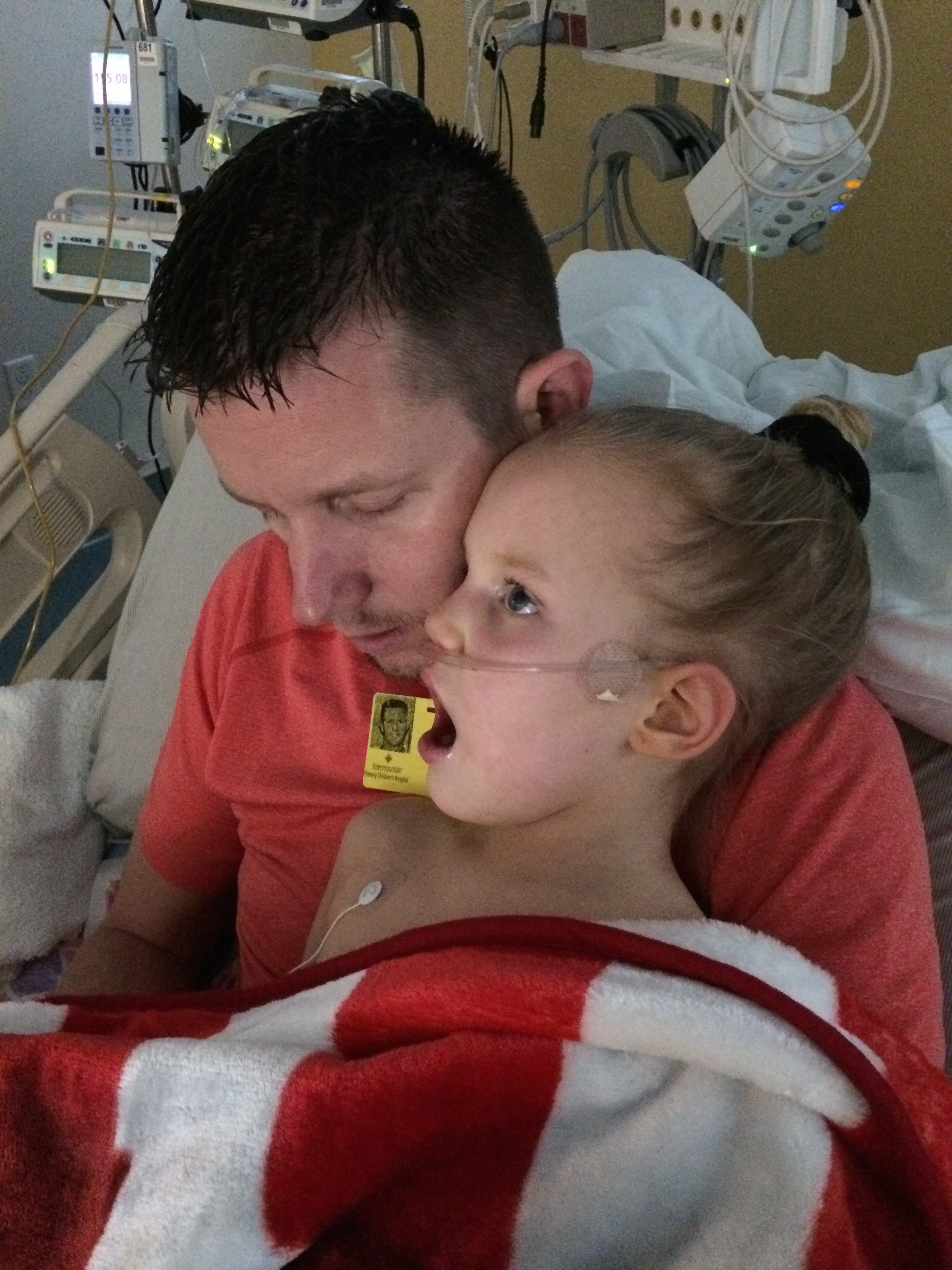 Taking turns holding Kycie as she suffered from PICU delirium.