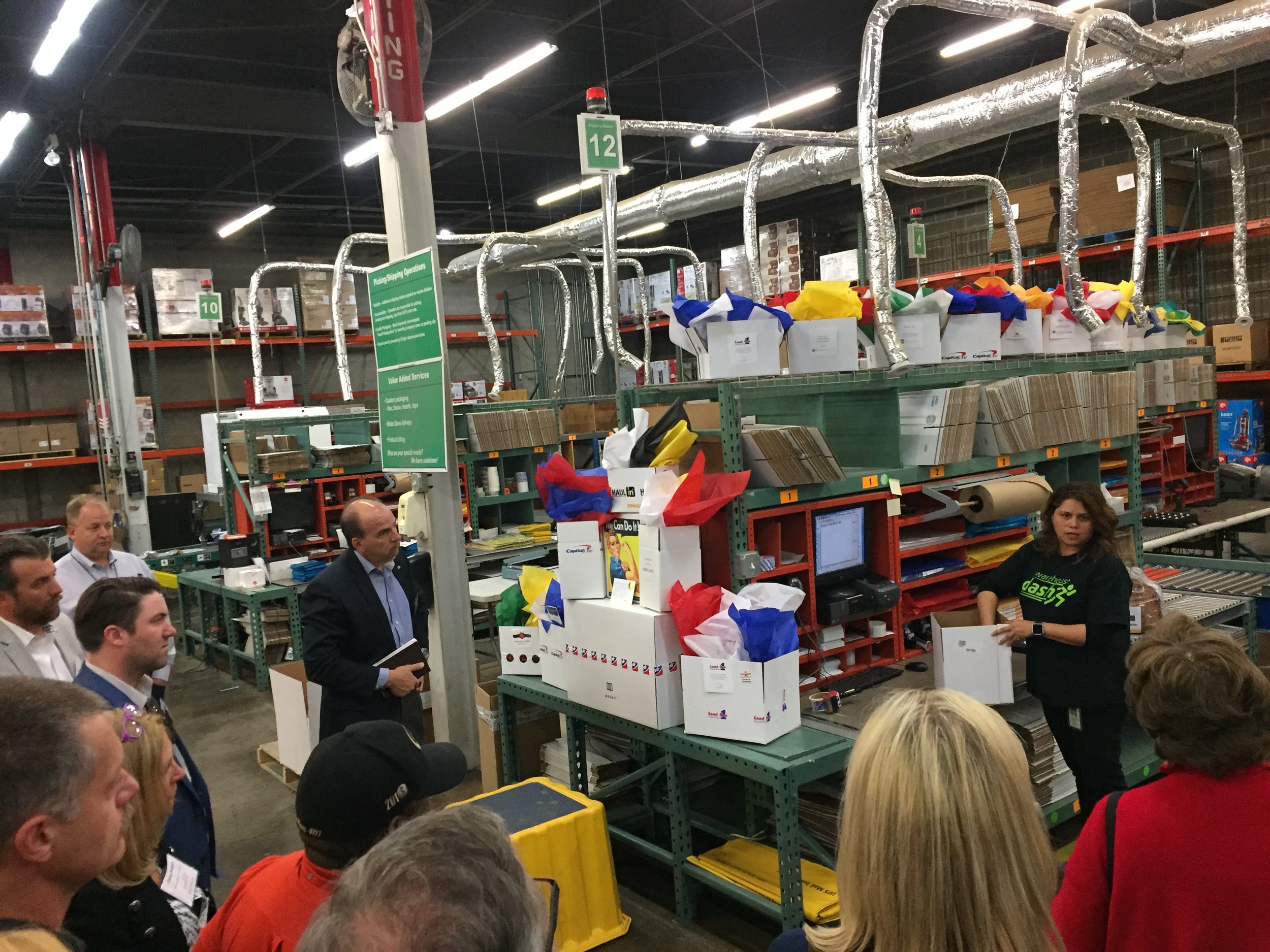 Our dedicated staff giving a tour to participants on our custom packaging and just how meticulously awards are prepared and shipped from our warehouse. 
