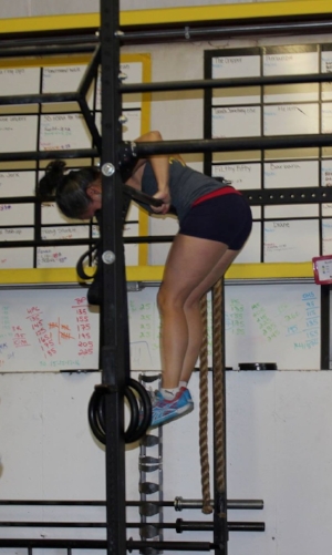 That's me last year at the top of my first bar muscle up during the CrossFit Open Comp. I did 5 of those suckers this year and felt great. Must have been the "Tiger Blood".