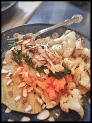 My dinner made with leftovers. Plantain Tortilla topped with grilled chicken, sauteed spinach, sweet potato, and sliced almonds. Baked cauliflower on the side.