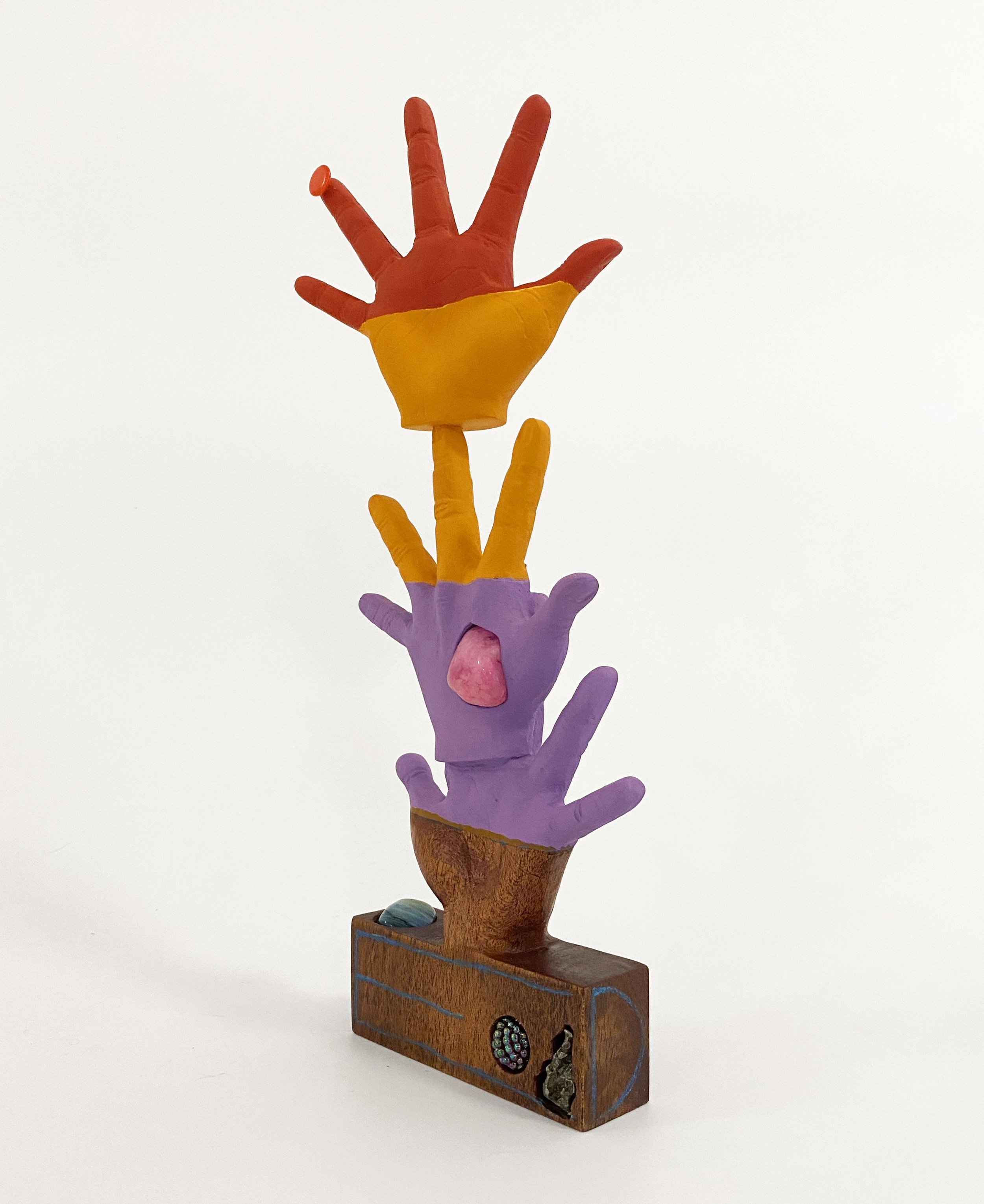   Hand Tree , 2023, meteorite, thumb tack, bread, rocks, casein, colored pencil, and carved mahogany, 12” x 4” x 2” 