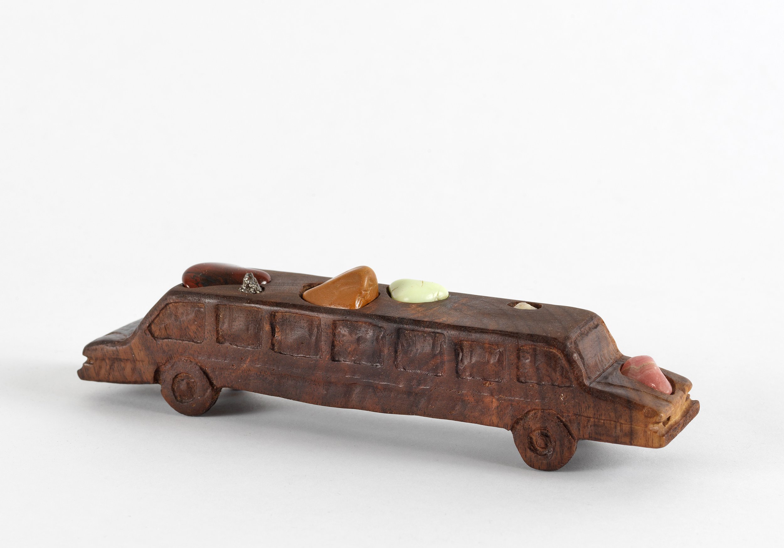   Limo , 2020, rocks, meteorite, and shell on carved walnut, 2” x 1.5” x 7” 
