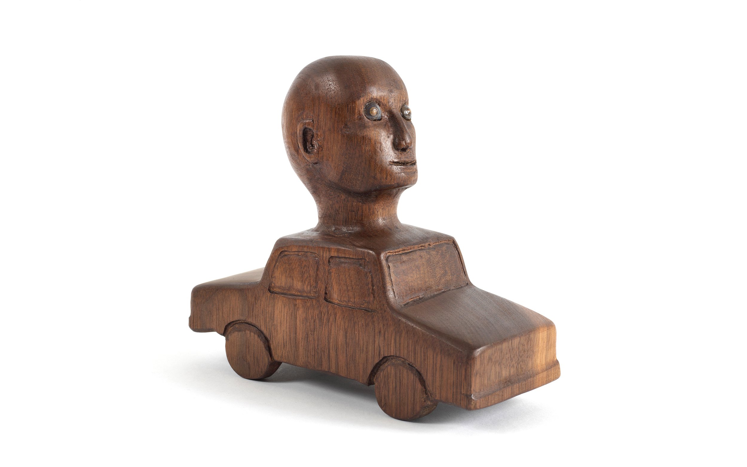  Car with Head , 2020, shells on carved walnut, 6” x 3” x 6.75” 